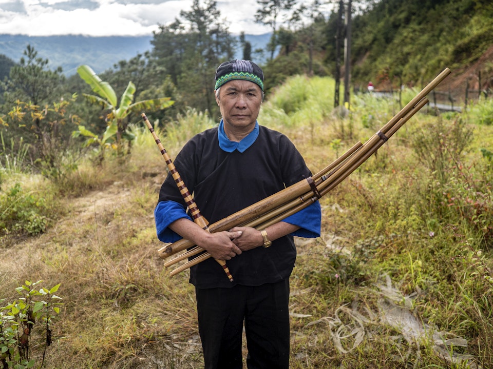 Hmong man guides the spirits to their final resting place