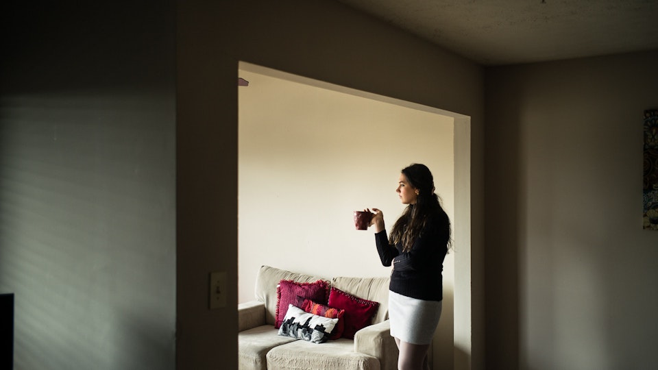 Select Editorial – 2018/19 - BIRMINGHAM, AL – FEBRUARY 16, 2018: Anna Lewis, 25, stands in a sober living apartment where she is in recovery for alcohol addiction. 

As a teenager, Lewis first encountered opiates through pain medication that was prescribed to her after a car accident in high school. Oxycontin, the social drug of choice at the time, was so prevalent in her hometown of Pensacola, Fla., that experimentation was easy. “I didn’t even have to look for it. It was just there – at my work, or my friends had it,” she said. “I didn’t realize I was addicted until I felt like I had the flu one day, and after using, I felt normal. That’s when I knew I had a problem.” Within a year, Lewis had switched to shooting heroine, and even moved to Atlanta where the drug was cheaper and easier to find. It took an arrest for possession while shoplifting books at a Barnes & Noble to finally realize she was an addict. “I’d spent all my money on dope,” Lewis said. “So those books were my friends. It’s hard to have real friends when you’re using. Dope is your priority. The people you’re around are sick too, so no one is looking out for you. Everyone’s focus is dope.” At age 19, Lewis finally kicked the heroine habit after checking herself into a detox program, but she soon turned to alcohol. “It only took about a year for me to become an alcoholic – needing it on a daily basis,” she said. Today, Lewis has been sober from alcohol for 3 months, but she says she’s painfully aware of the money her mother and grandmother have spent on rehab, and has felt obligated to pay back what she can. “My mom has always been there for me, and she still is,” Lewis said. “It’s been life saving to know that I’m able to call her anytime, and there will be love on the other end of the line.” 

The addiction crisis that is killing tens of thousands of Americans every year is also creating a financial crisis for many families, compounding the anguish caused by a loved one.