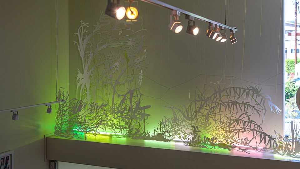Glitterati Swamp Thing - GLITTERATI SWAMP THING | site-specific commission | 14 x 10 x 3 feet | watercolor, iridescent medium on cut paper, fluorescent fixtures, color gel overlays  © CHRIS NATROP
