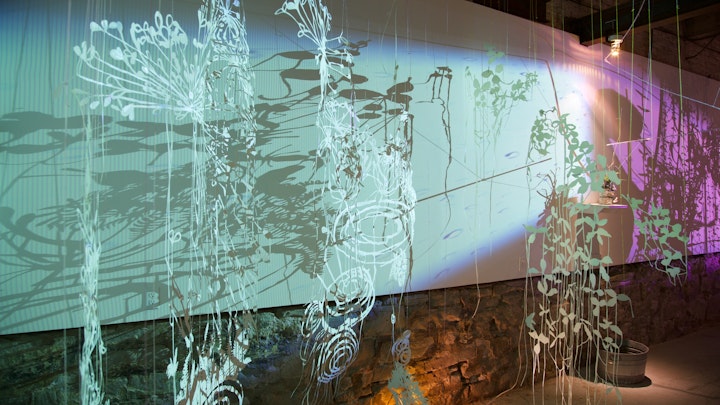Collaborative site-specific installation with Gregory Klassen | watercolor on hand cut paper, string, video projections, living sculptures, irrigation system | 2015